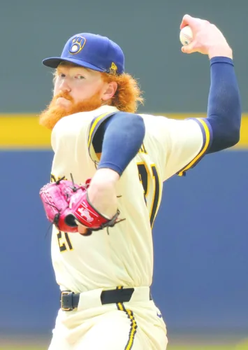 Newly acquired May pitches Brewers to victory